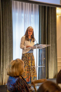 Emcee Jennifer Schade opening the event